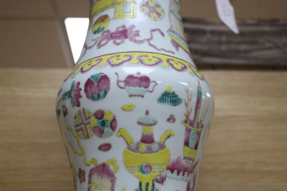 A Chinese famille rose hundred antiques vase, 19th century, H.37.5cm, drilled hole to base